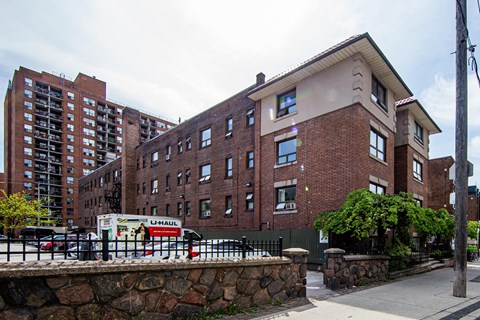 a brick building with a truck parked in front of it